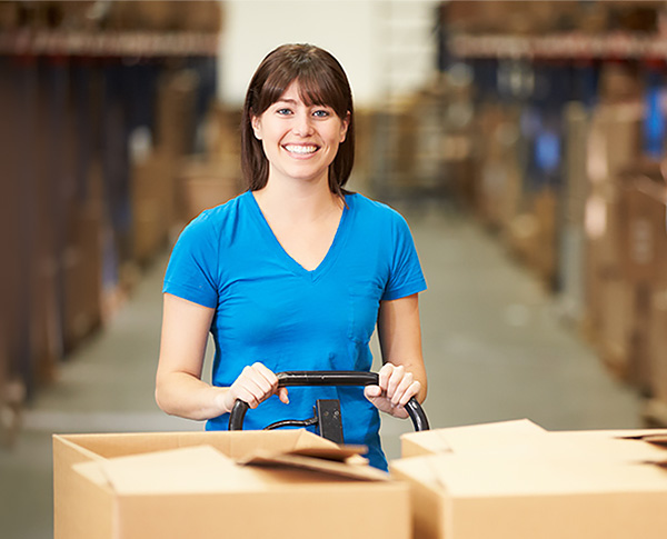 woman-with-boxes-on-cart-smiling